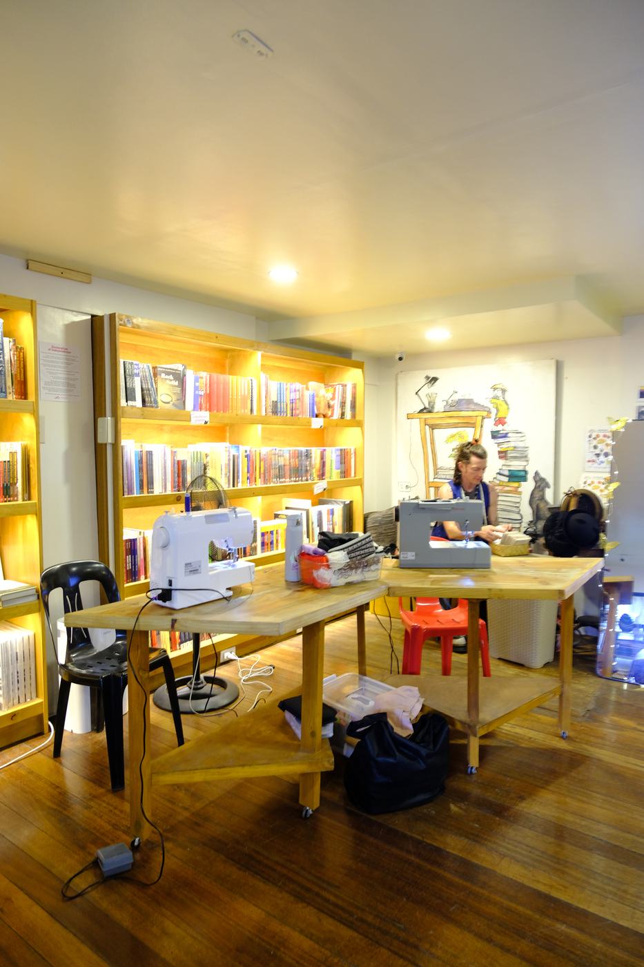 Sewing machines set up on a table inside the bookshop